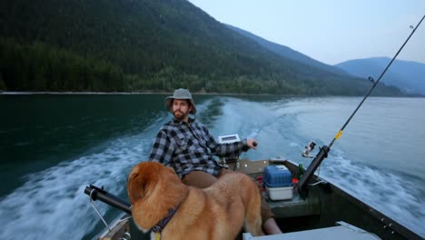 fishermen travelling with his dog in the boat 4k