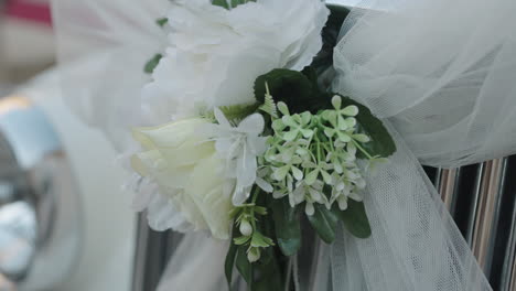 White-Wedding-Car,-old-timer-wedding-car-with-flower-decor-from-side-view-close-up