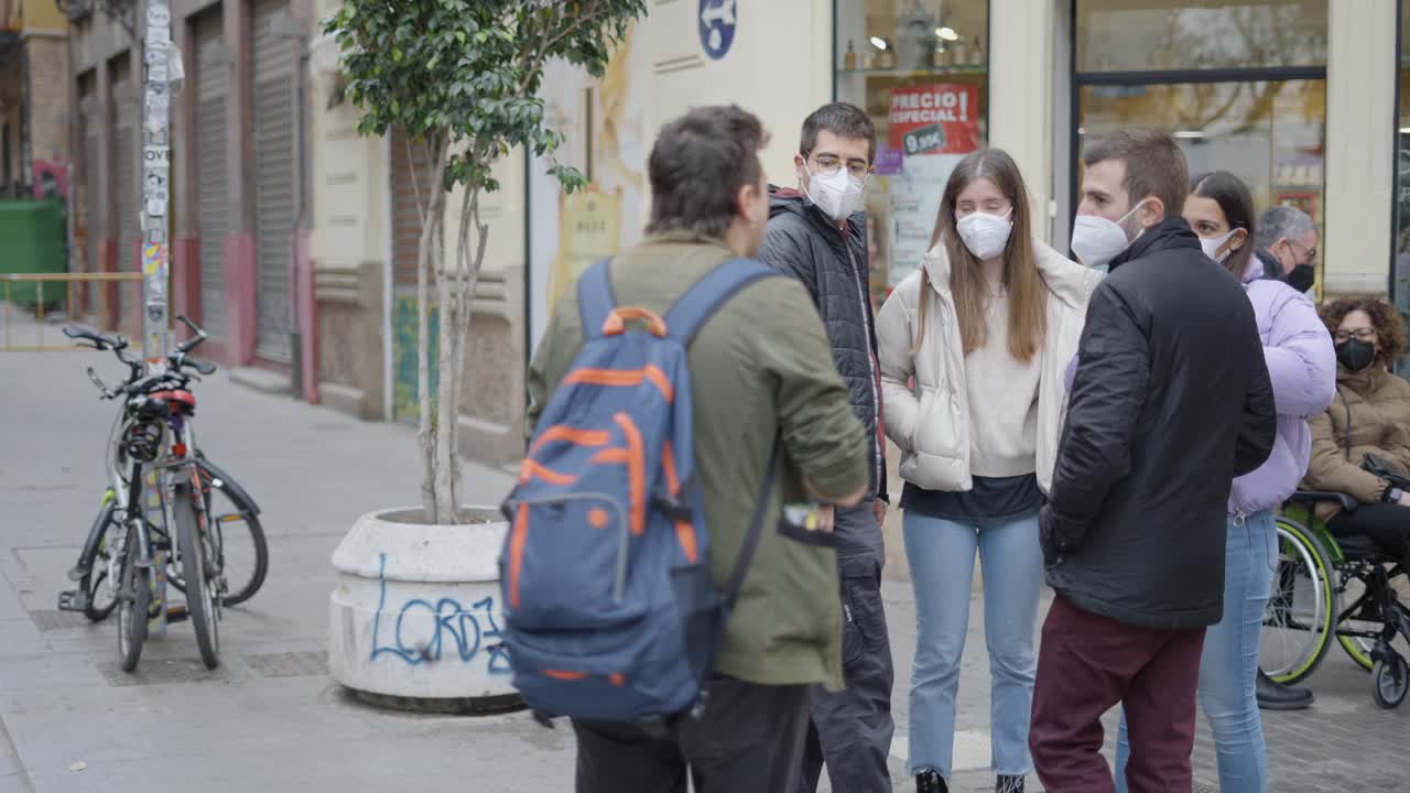 People wearing masks in city street