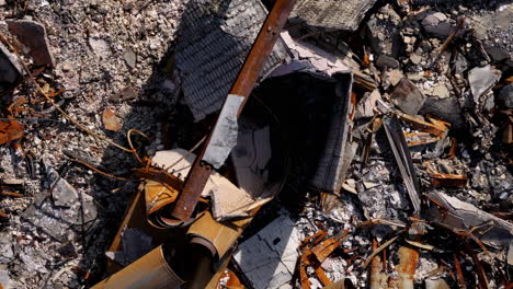 close-up aerial view of building rubble and fire damage