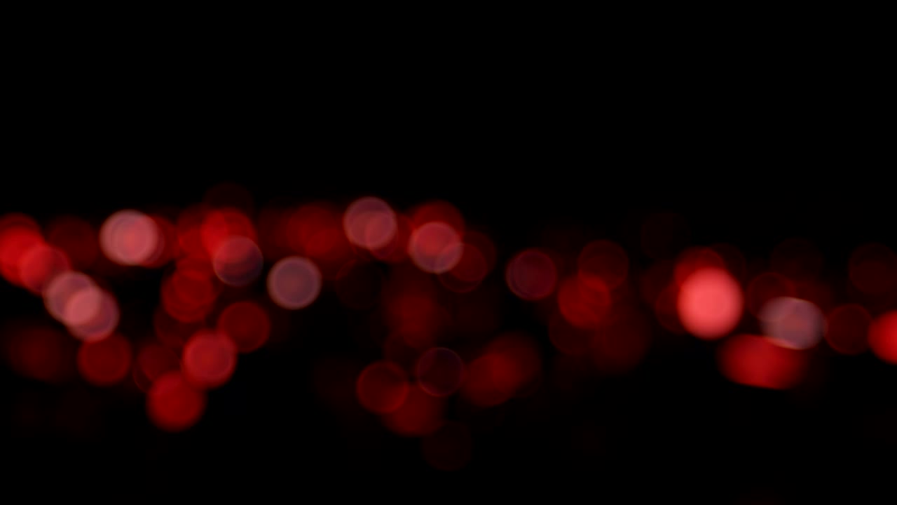 animación de alta calidad roja de fondo de navidad abstracto borroso con luces desfocalizadas bokeh. bucle sin costuras