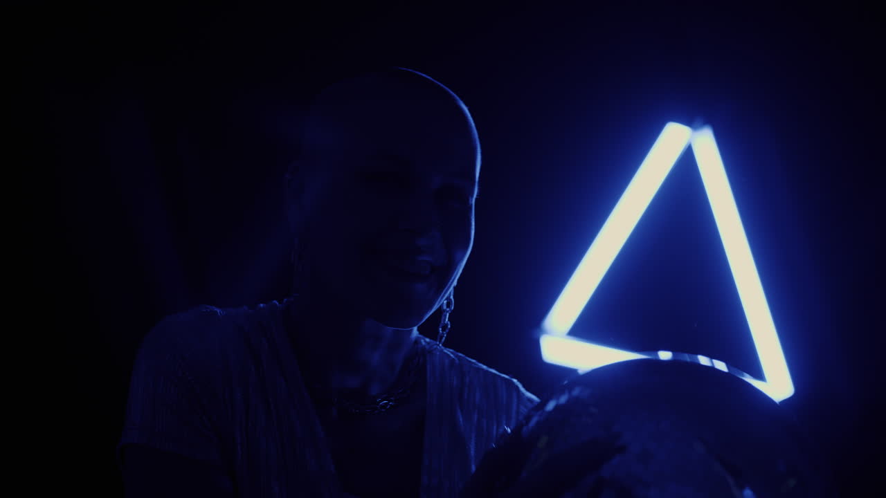 Woman with Disco Ball Under Neon Light