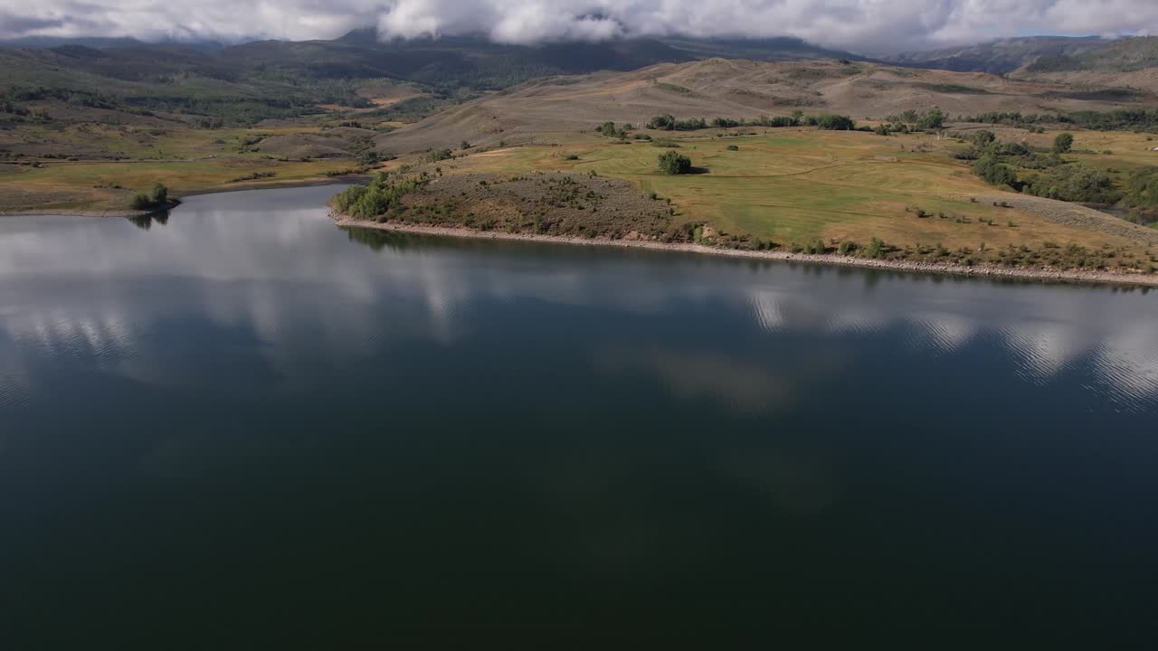 Drone Shot of Blue River Water Reservoir and Green Mountain Landscape, Colorado USA
