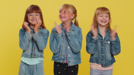 excited happy teenage girls winning prize celebrate birthday, little child sisters celebrate success