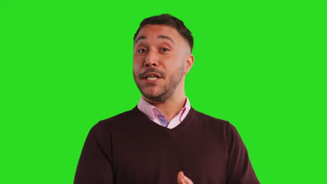 close up studio portrait of mature male teacher talking to class standing against green screen background 4