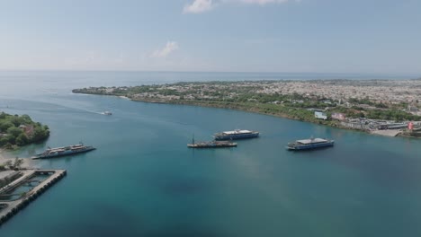 a drone shot of the likoni channel in mombasa with ferries and clear blue waters