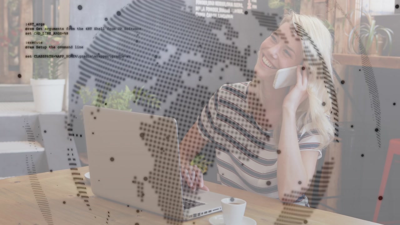 Woman typing on laptop, reaching phone, starting business call while dotted globe graphic shifting