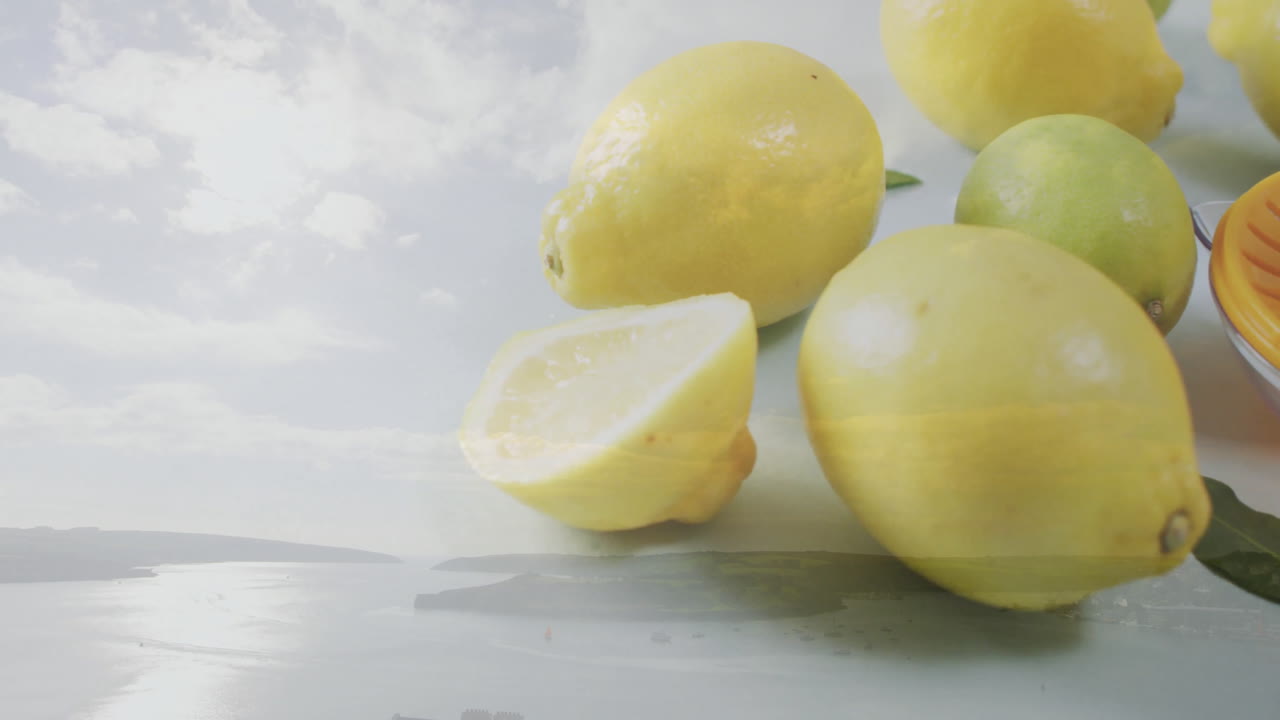 Blending animation of lemons and sky over serene coastal landscape