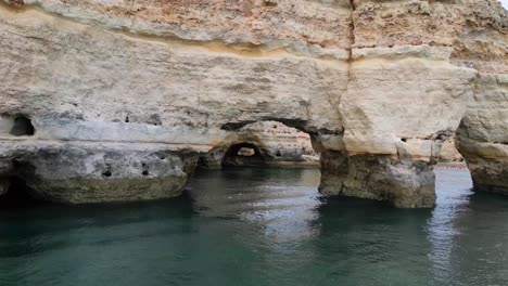 Drone-flying-through-arch-at-Elephant-Rock-on-Portuguese-Coast