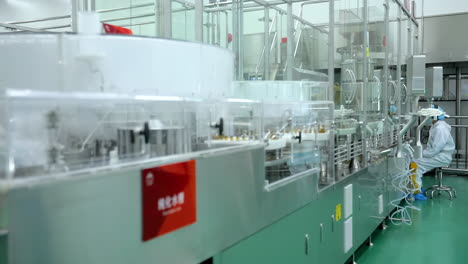 assembly lines with medical vials automated pharmaceutical factory oral liquids production line on conveyor belt with amber glass bottles being filled with medication at a pharma plant modern industry