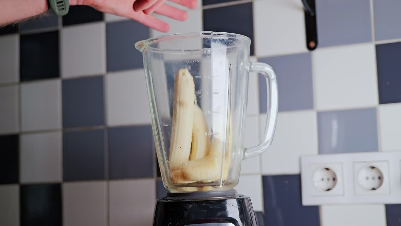 Peeled banana falls in slow motion inside old Soviet-era apartment kitchen, 4K
