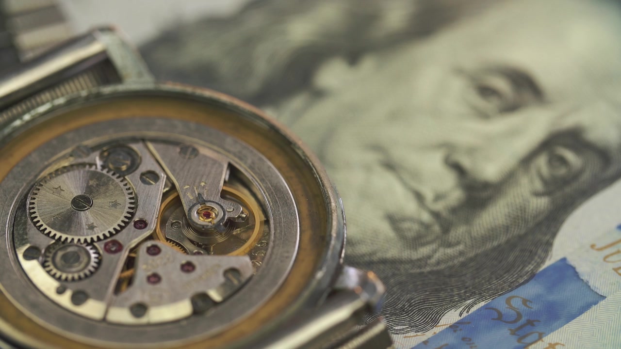 Close-up of Mechanical Watch Movement on US Dollar Bill