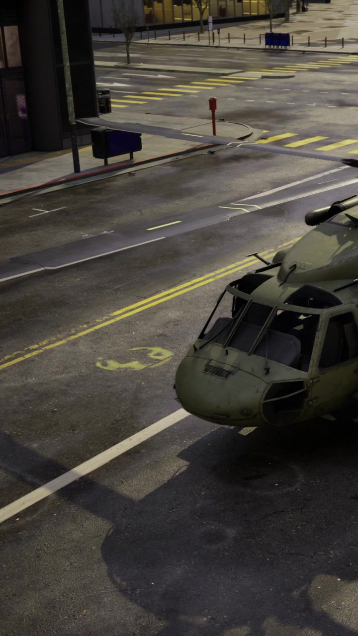 Military helicopter on city street near buildings and traffic signs
