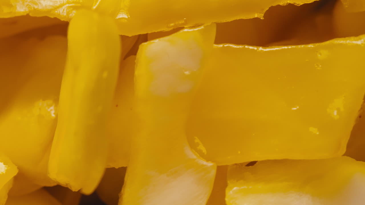 Close-up of fermented yellow cabbage on plate. Preservation of vegetables in glass jars. Fermentation preserved vegetables. Sauerkraut with spices.