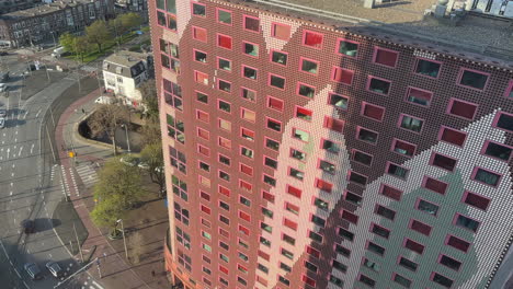 Aerial-view-of-artistic-apartment-building-next-to-the-road-in-the-Hague,-the-Netherlands