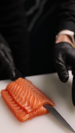 chef preparing salmon sashimi