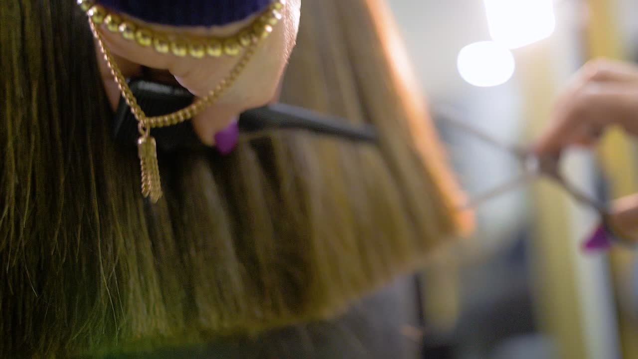 Woman Getting a Haircut at a Hair Salon