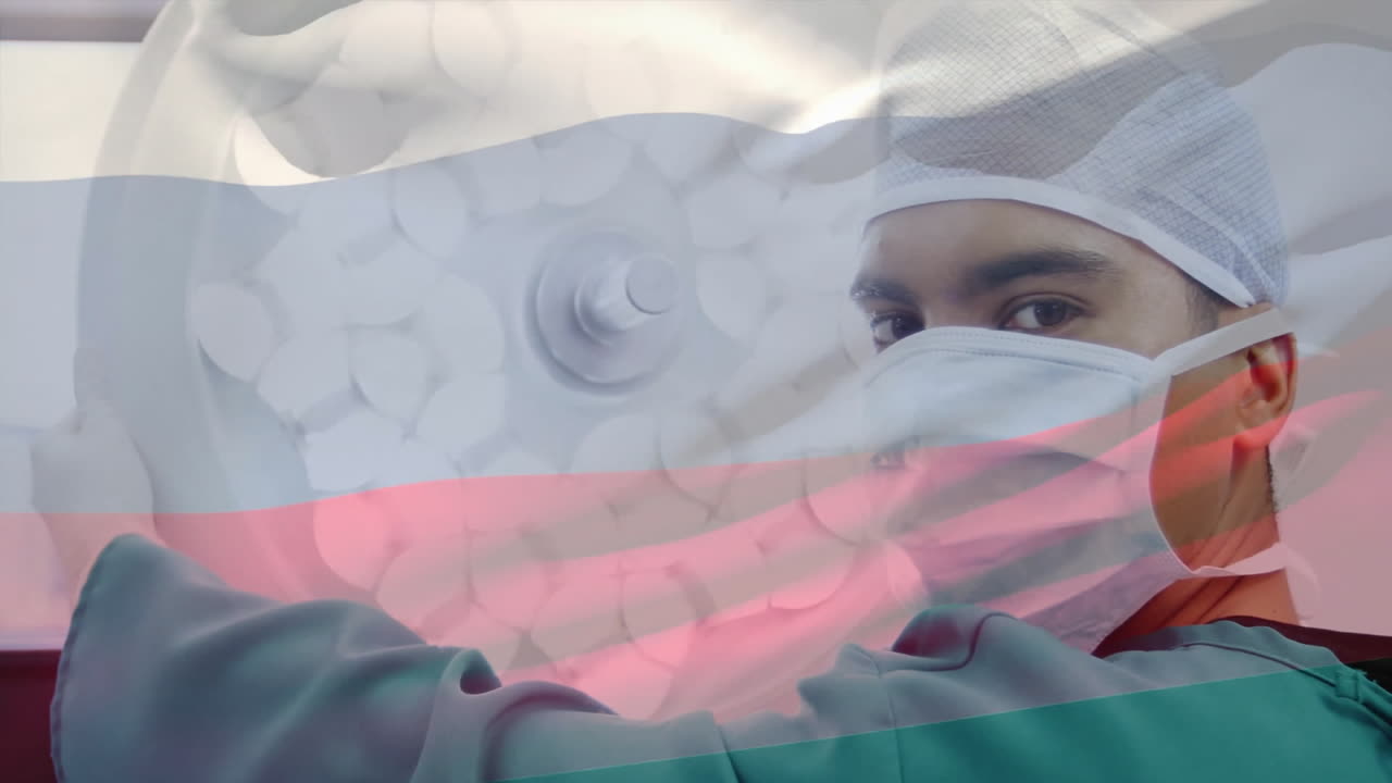 Animation of flag of russia over biracial male surgeon preparing lamp in operating room
