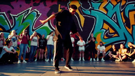 street dancer performance with graffiti background