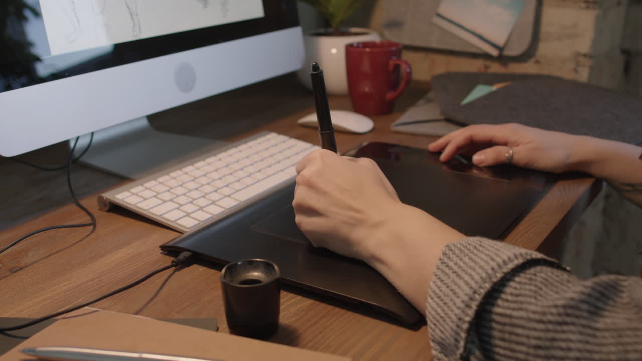 Graphic Designer Drawing On Tablet