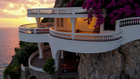 luxury cliffside villa with ocean view at sunset