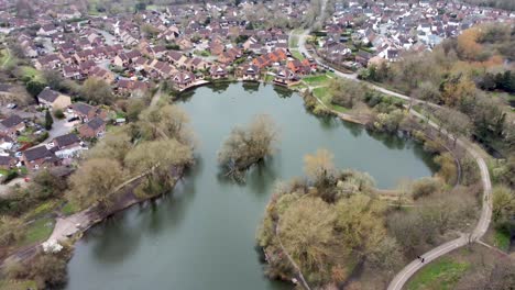 a drone shot flying over the singleton lake looking in on town