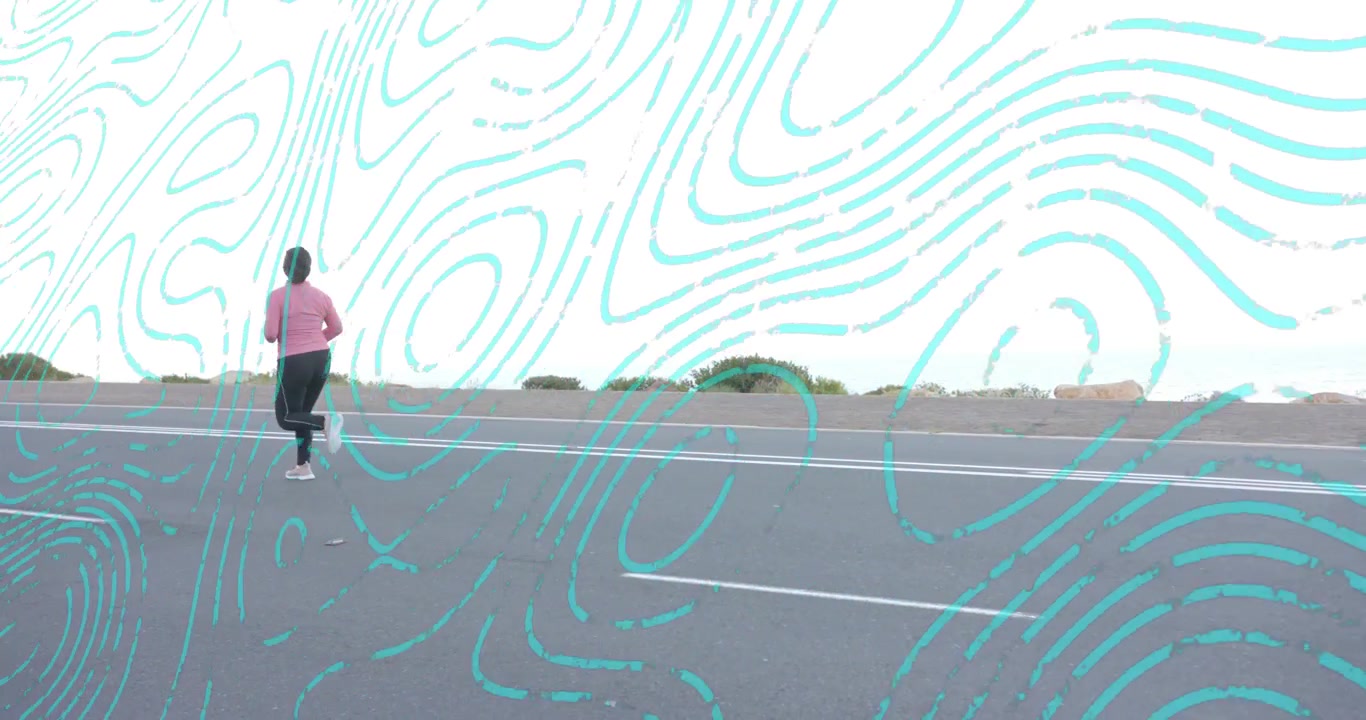 Female runner starting fitness training on desert road, jogging past white lane markings