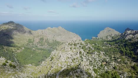 4k drone time lapse in mountains with moving shadows of clouds - mallorca serra de tramuntana sa calobra - balearic islands, mediterranean sea - epic dramatic landscape