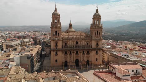 Spain-Jaen-Cathedral,-Catedral-de-Jaen,-flying-shoots-of-this-old-church-with-a-drone-at-4k-24fps-using-a-ND-filter-also-it-can-be-seen-the-old-town-of-Jaen