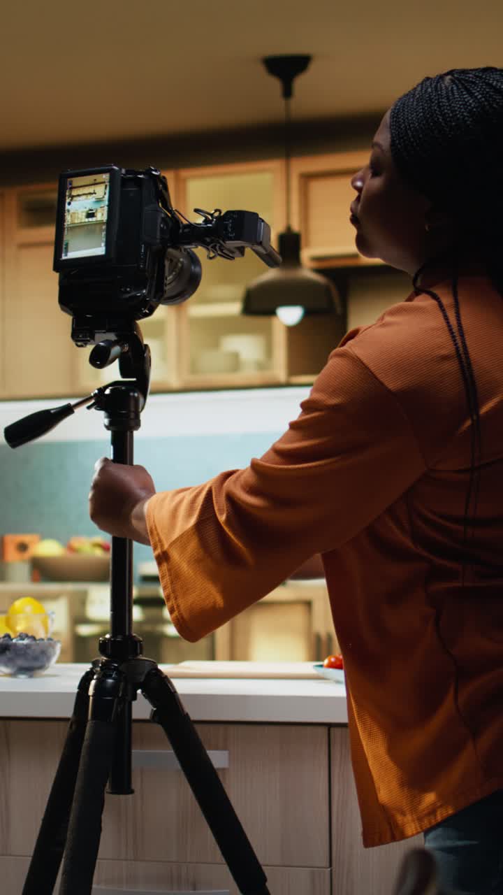 Vertical Video Food content creator fine tuning camera settings before filming recipe video