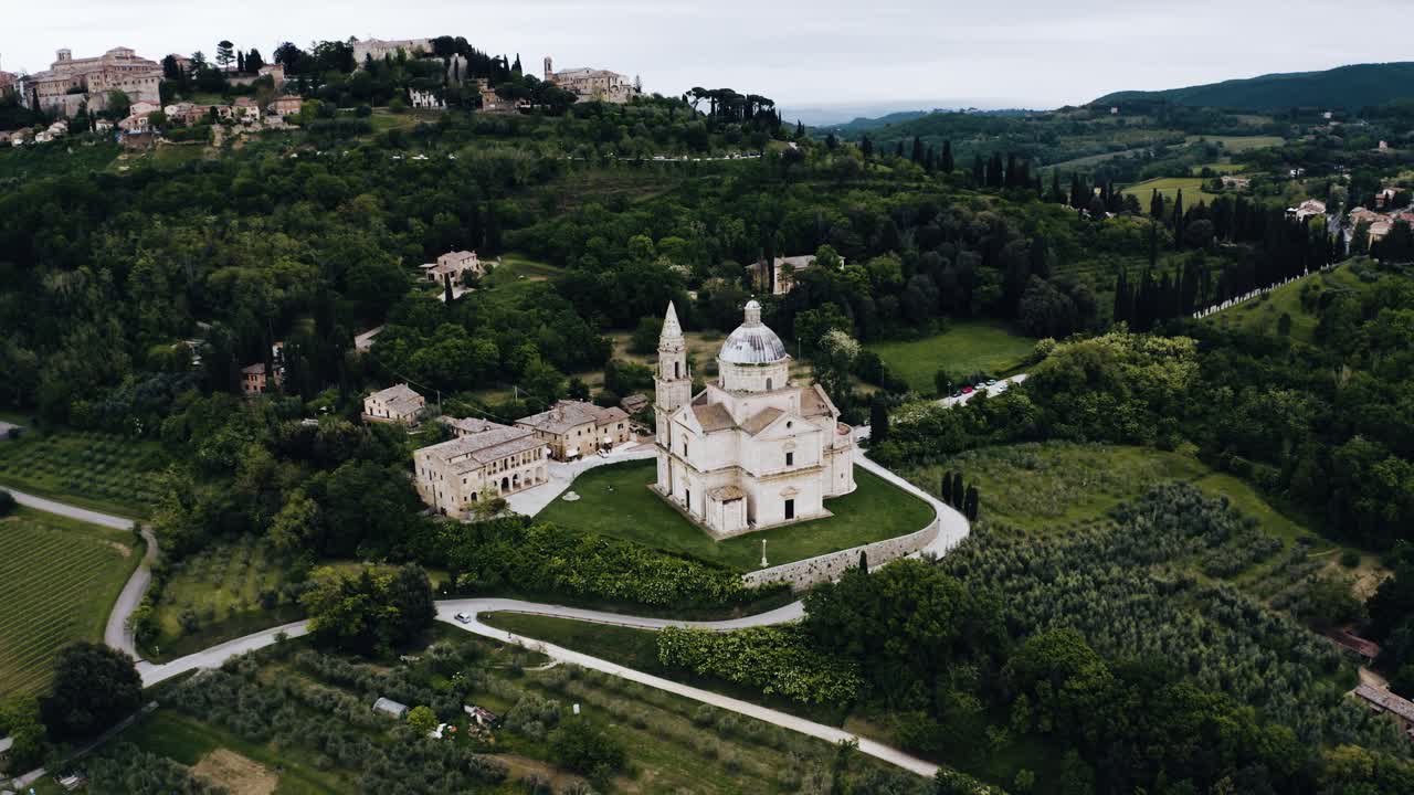 Aerial view pulling away from historic Sanctuary of the Madonna in Italy's countryside