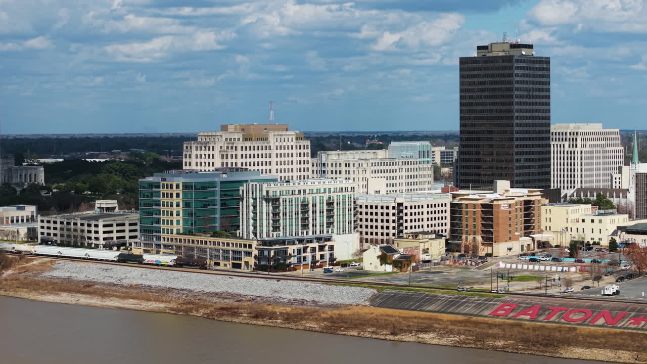 Aerial tracking shot in front of the cityscape of Baton Rouge, in sunny Louisiana, USA