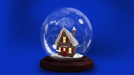 Animation-of-christmas-snow-globe-with-house-over-blue-background
