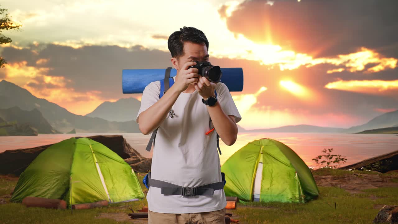 Man taking pictures during a camping trip at sunset