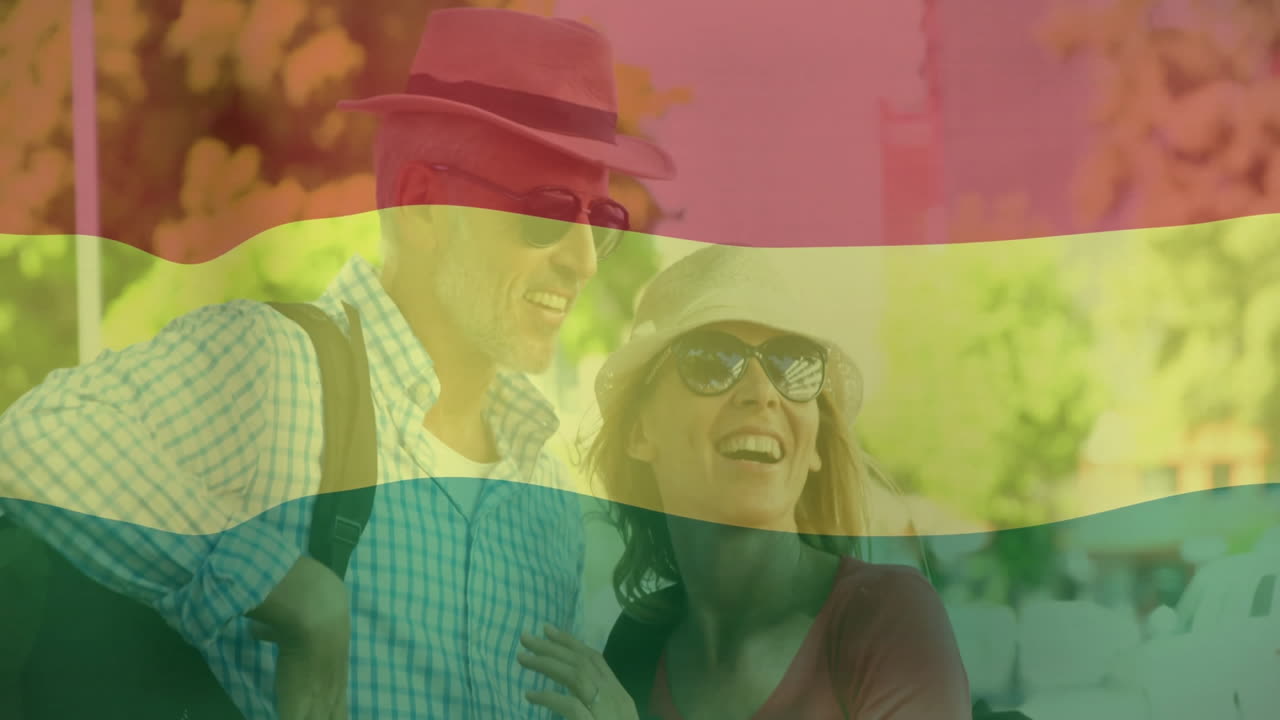 Wearing hats and sunglasses, couple with colorful overlay animation outdoors