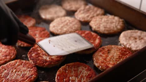 cooking hamburgers on a griddle
