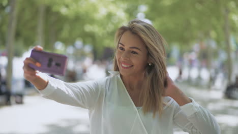 happy young woman taking selfie outdoor