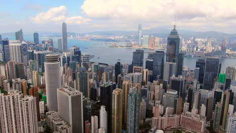 hong kong skyline and skyscrapers overlooking victoria bay on a beautiful day