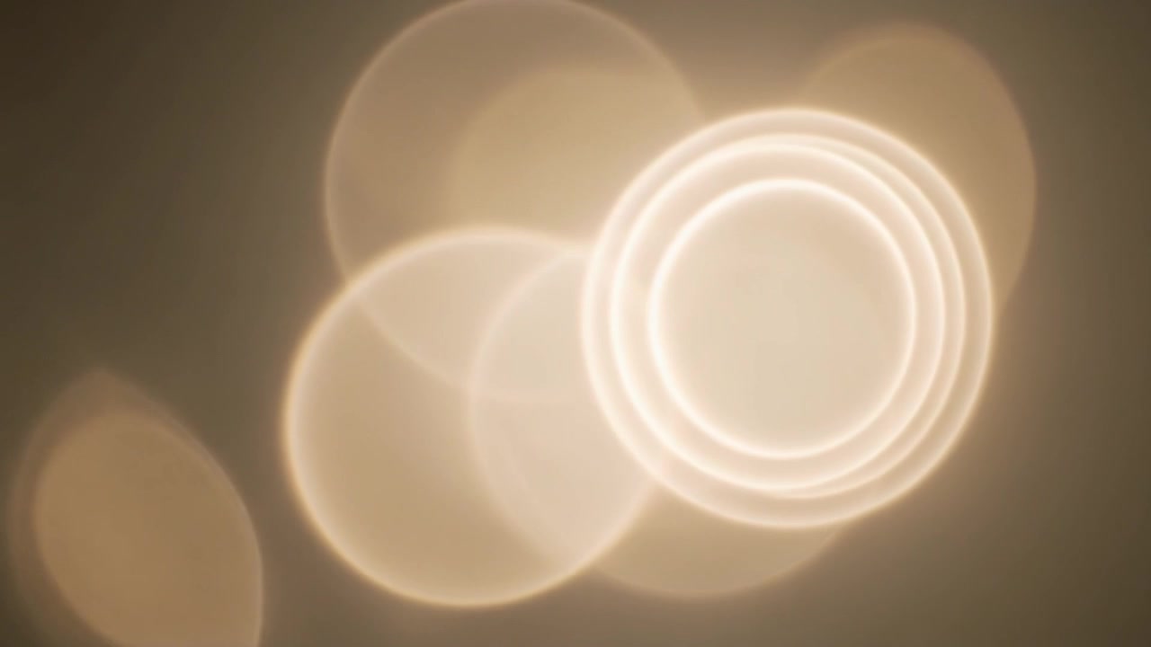 Perdite di luce dorate astratte ed effetto bokeh in sovrimpressione