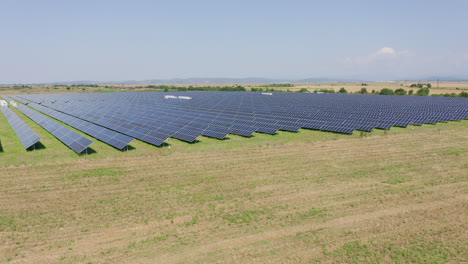 aerial view of solar farm - solar panels under the sun in rural field