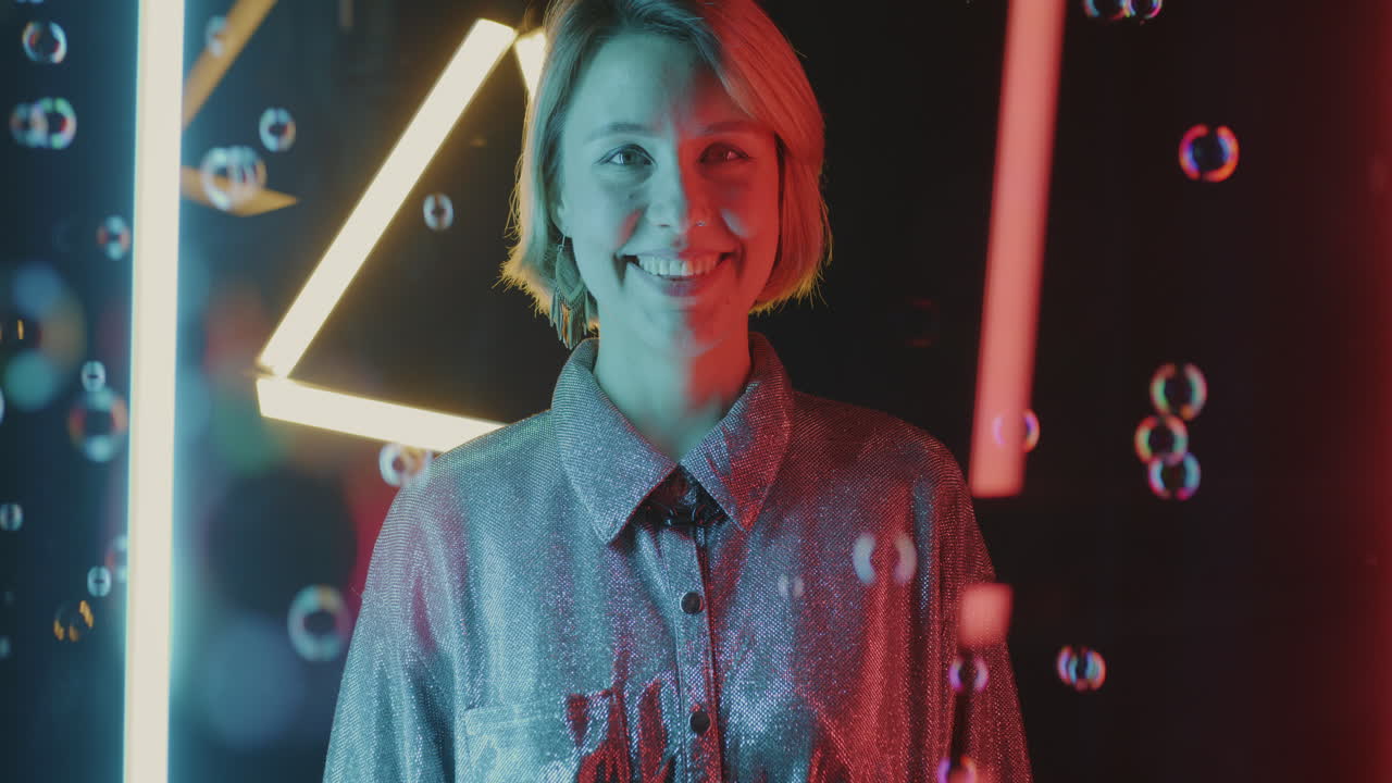 Woman Smiling with Bubbles and Neon Lights
