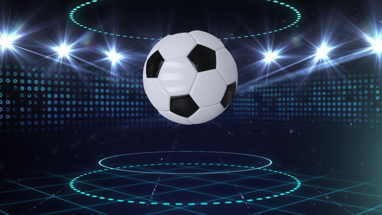 Digital animation of a rotating football at a lit stadium highlights ...