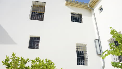 white building with barred windows
