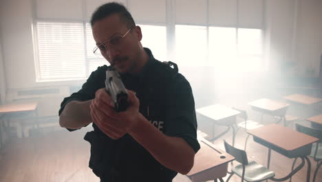 police officer in a classroom with gun drawn