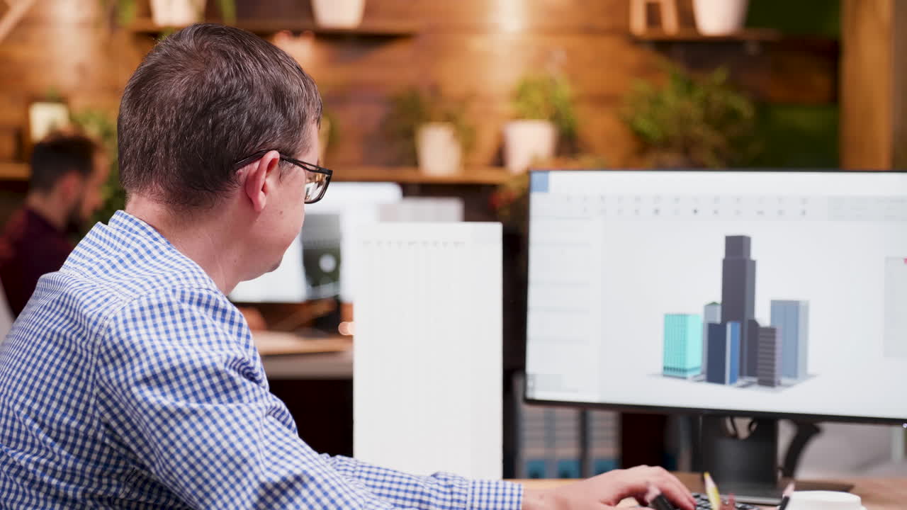Man working on 3D architecture design on computer