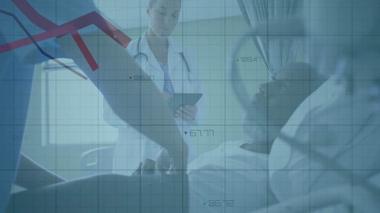 Female doctor and assistant reviewing patient data in hospital, showing animated health graphs