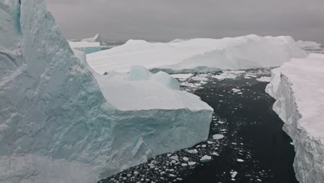 drone over sea and ice of ilulissat icefjord