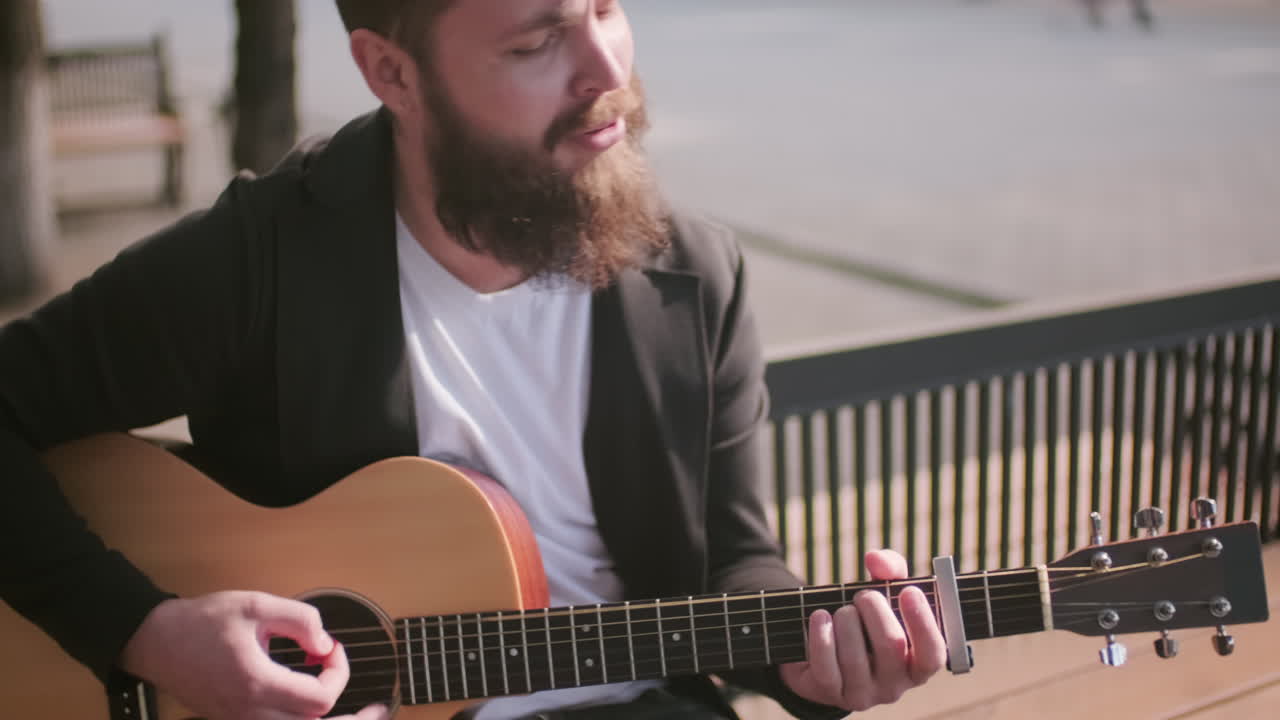 Street Musician Playing Guitar and Singing