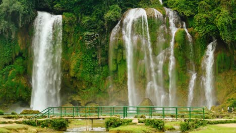 small bridge in front of the giant ban gioc waterfall in cao bang in northern vietnam