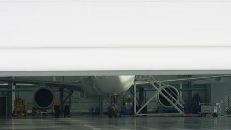 airplane maintenance in a hangar